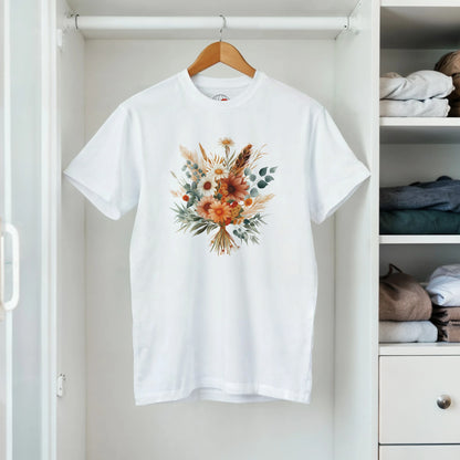 A white t-shirt with a floral design on a hanger in a closet.