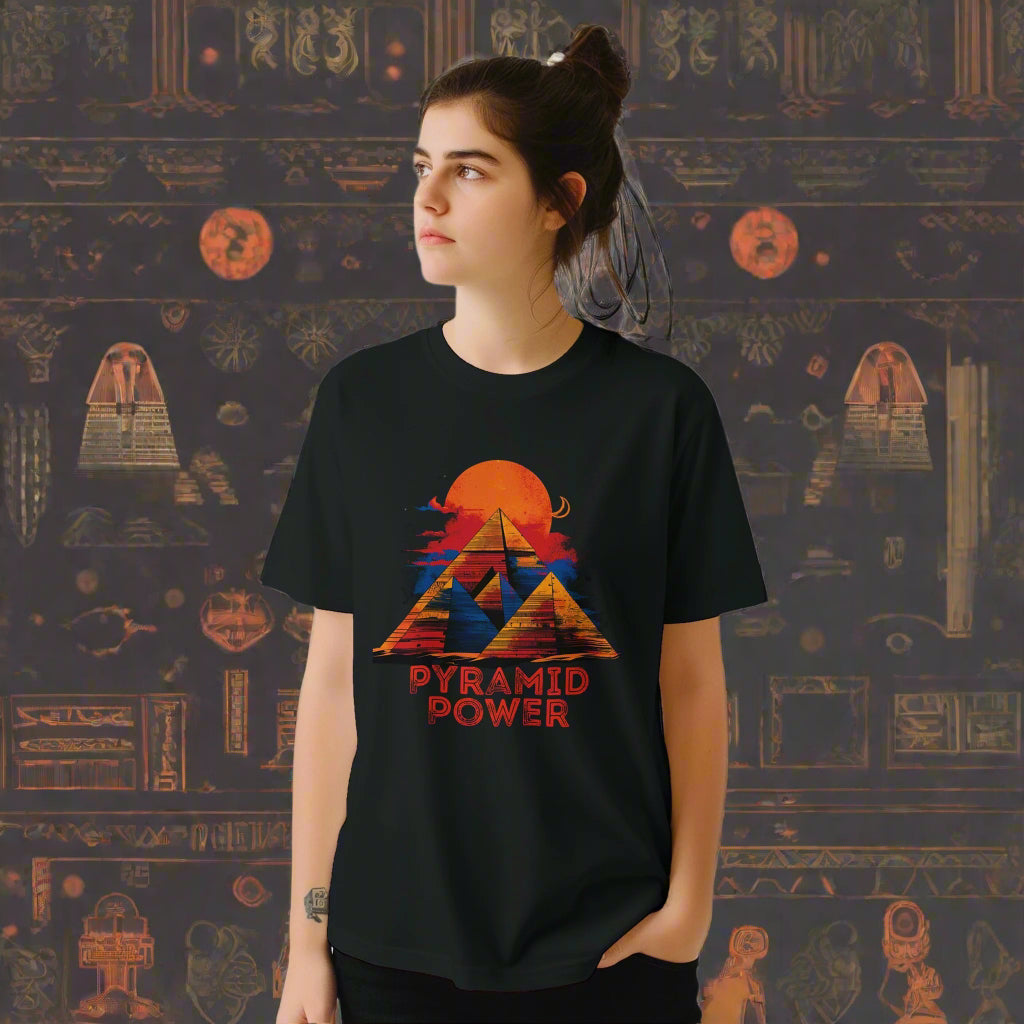 A young girl wearing a black T-shirt with pyramids and sacred geometric lines – bold sun set symmetrical design on Gildan cotton 