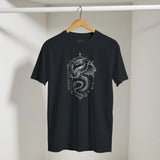 Black t-shirt with dragon design on a hanger against a neutral background