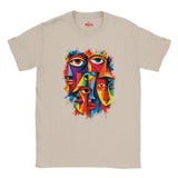 A beige crewneck t-shirt featuring a colorful graphic print of stylized faces with eyes, designed in a geometric, cubist style with vibrant paint splatters. The brand name 'Myts' is printed inside the collar.