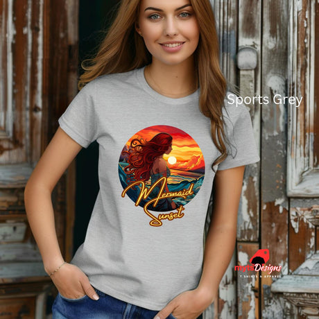 A woman wearing a Sports Grey  Mermaid Sunset T-shirt