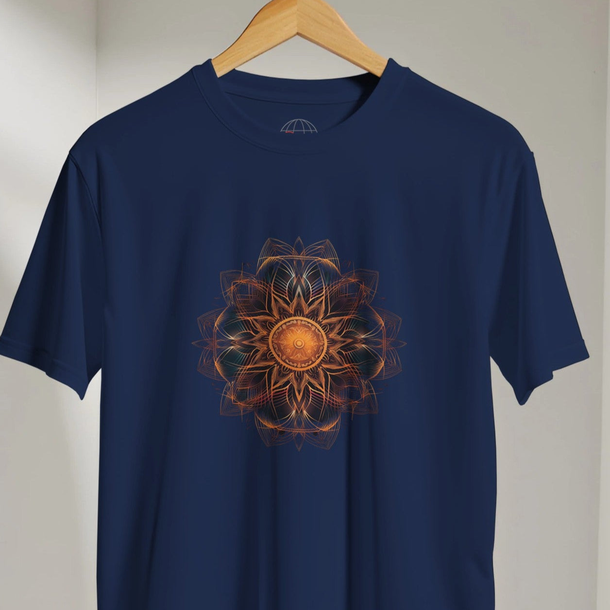 Navy blue t-shirt with a sunflower design on a hanger against a white wall.