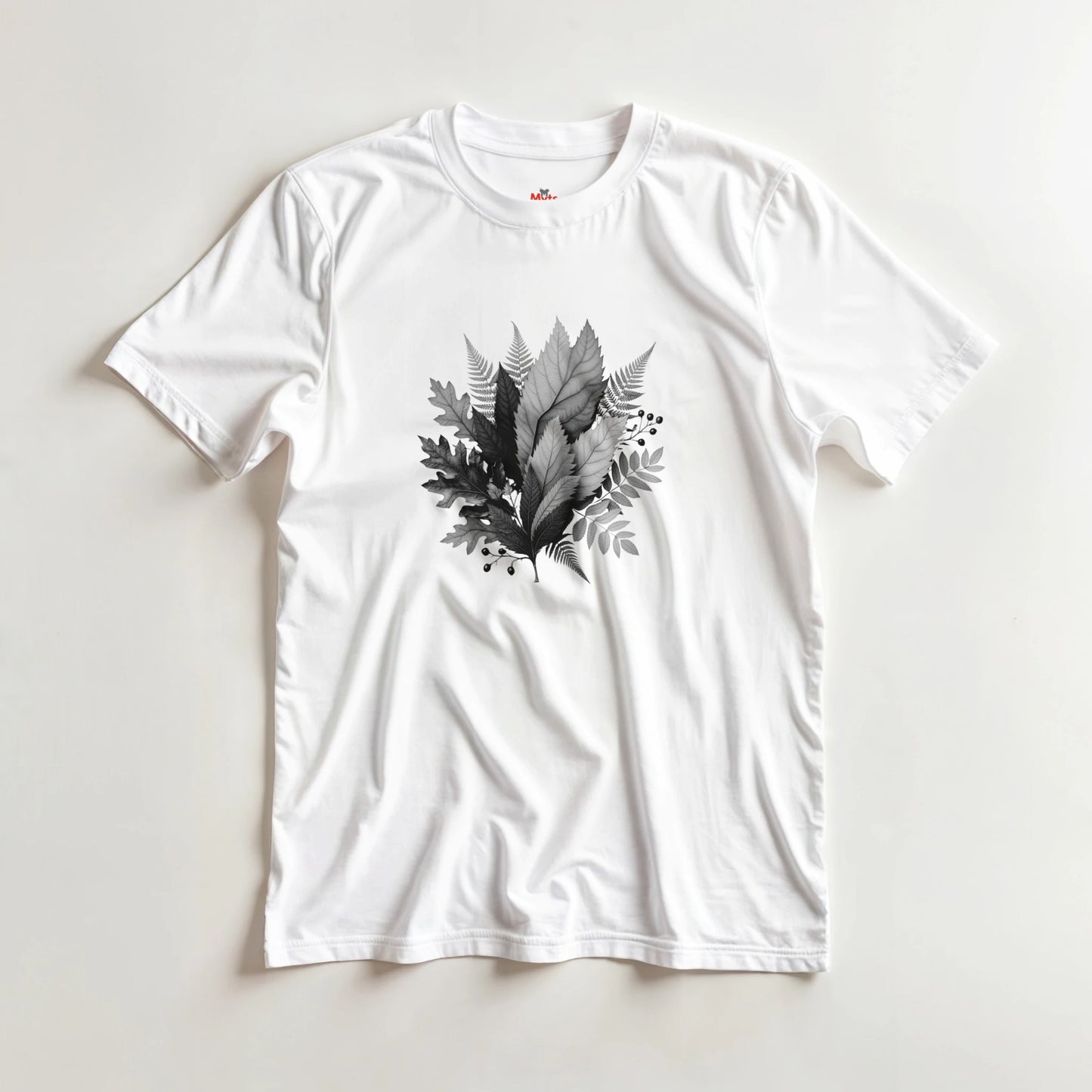 White t-shirt with black leaf design on a light gray background