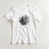 White t-shirt with black leaf design on a light gray background