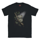 A black short-sleeve crewneck t-shirt featuring a detailed graphic print of a koala sitting on a tree branch with eucalyptus leaves, set against a plain white background.