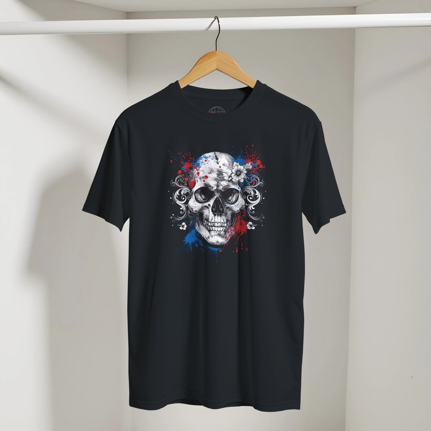 Black t-shirt with a skull design on a hanger against a plain background