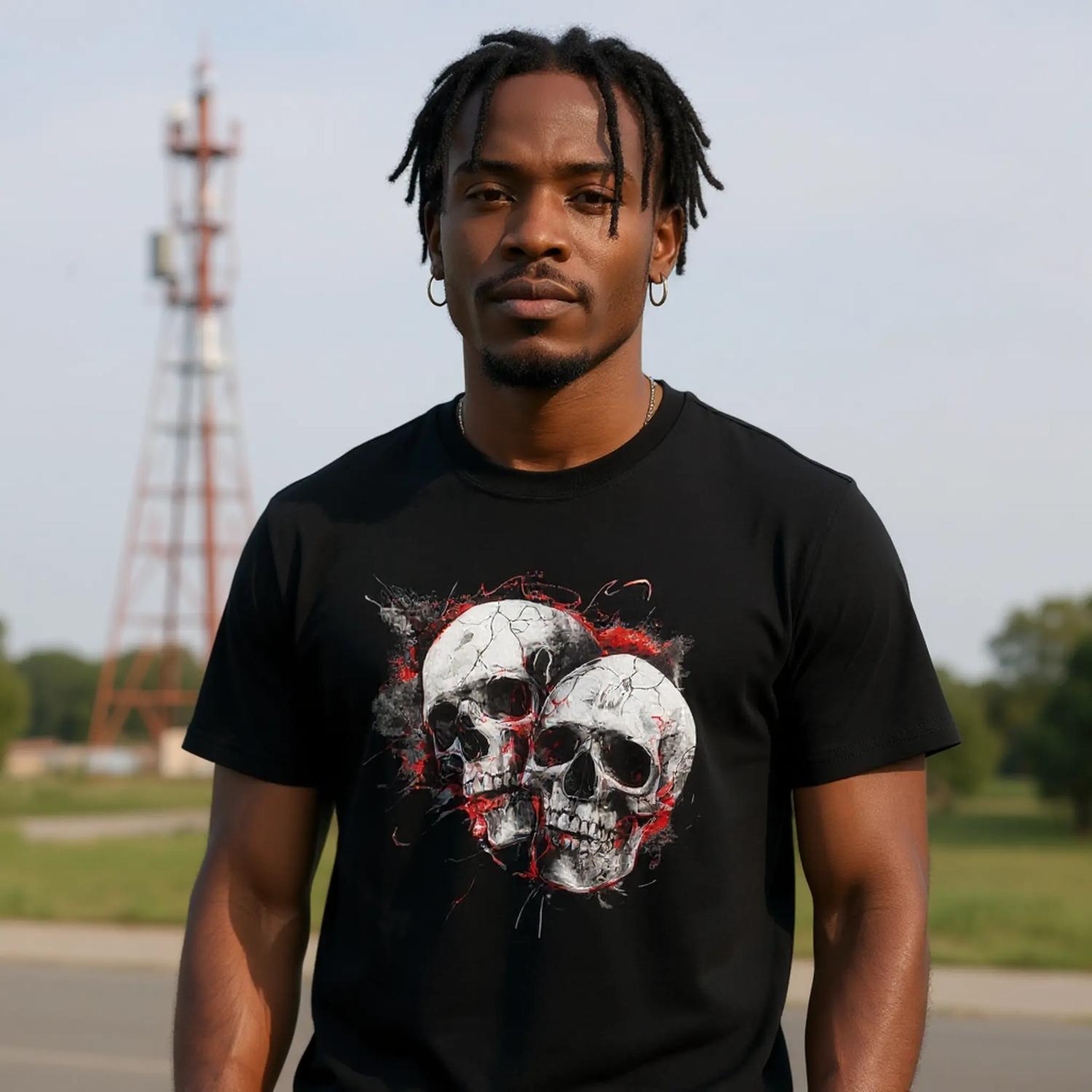 A man wearing a black t-shirt with a skull design outdoors