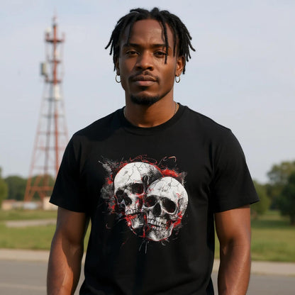 A man wearing a black t-shirt with a skull design outdoors