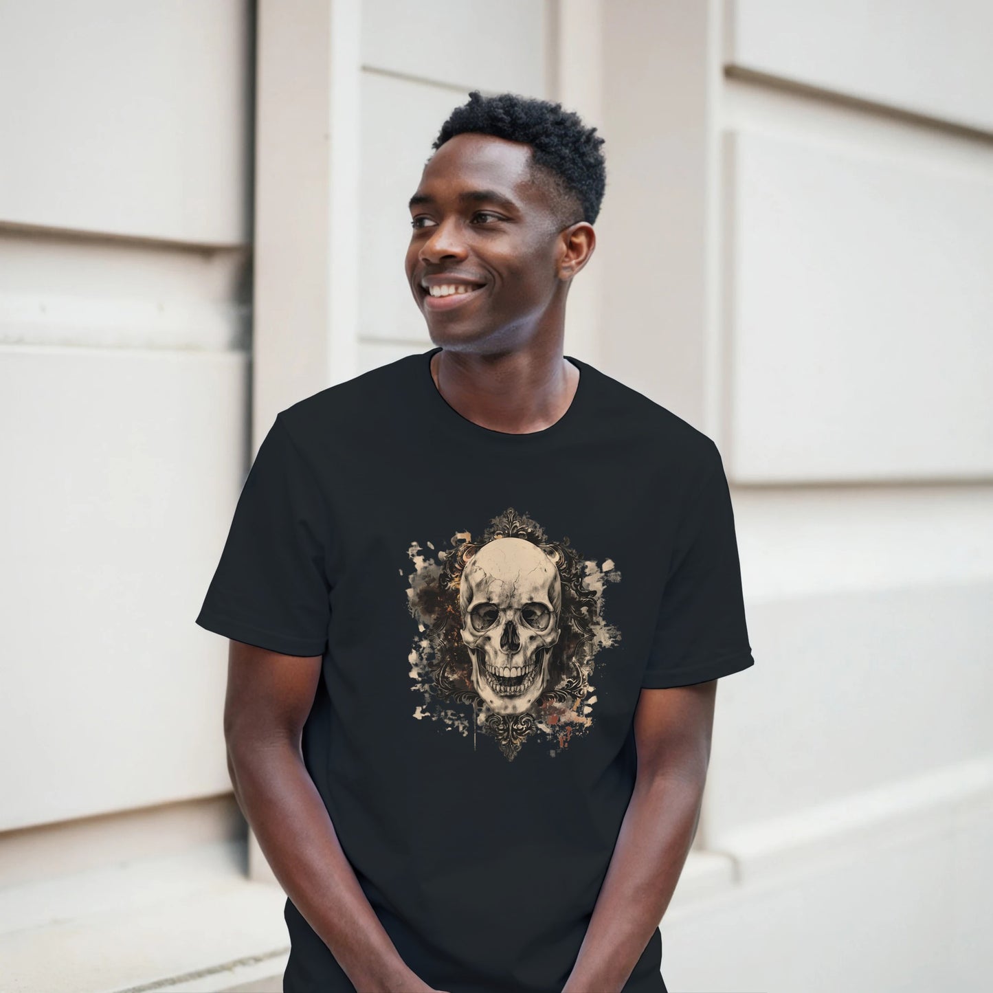 Man wearing a black t-shirt with a skull design outdoors
