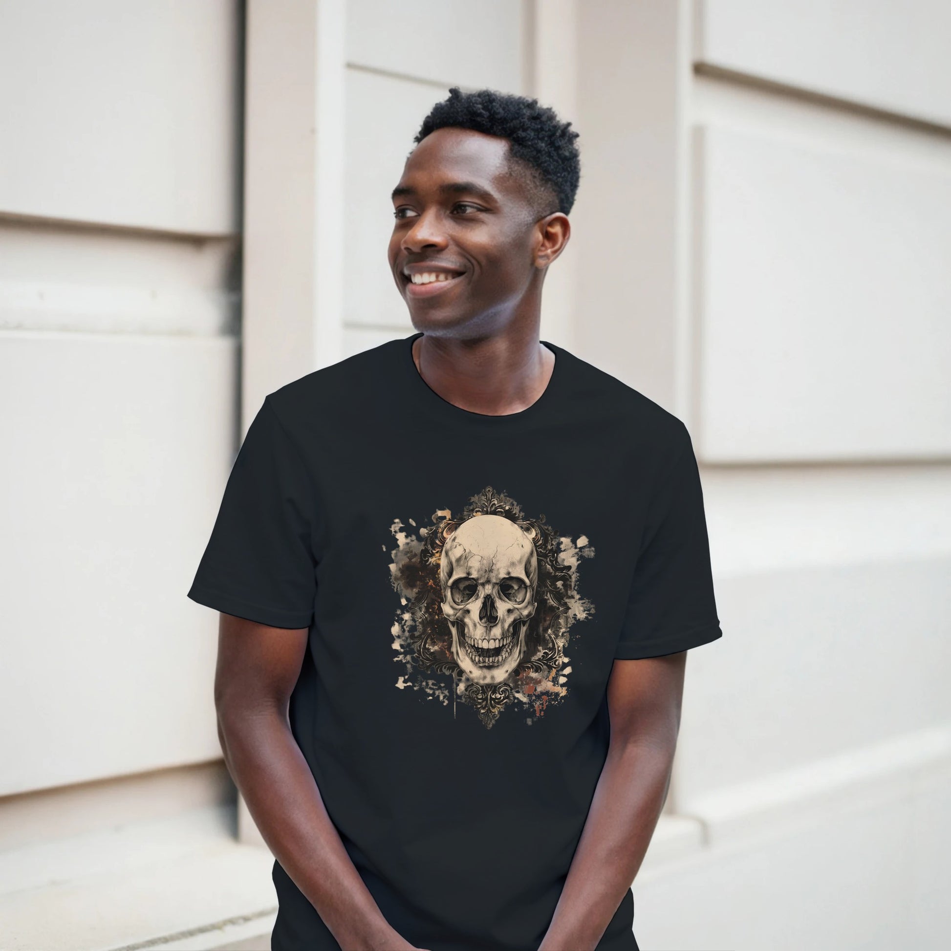 Man wearing a black t-shirt with a skull design outdoors