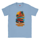 Light blue t-shirt with a graphic design of surfboards and palm trees on a white background