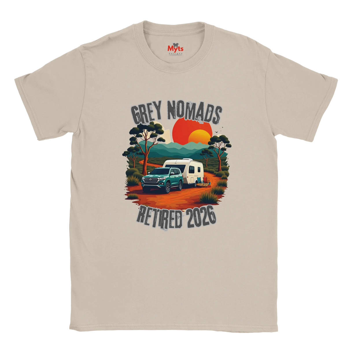 A Sand crewneck t-shirt featuring a retro-style graphic of a green pickup truck towing a white camper on an orange dirt road, with a red and orange sunset and the text 'GREY NOMADS RETIRED 2026'. The inner collar shows the 'Myts' brand logo.
