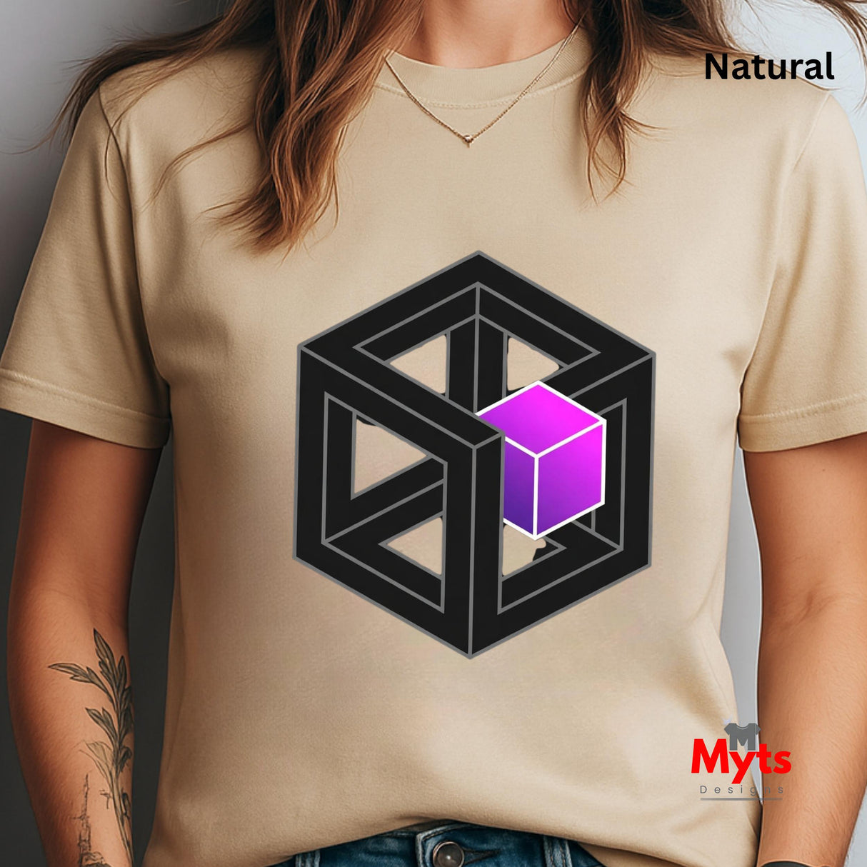 Natural t-shirt with a black geometric design featuring a purple cube, worn by a person.
