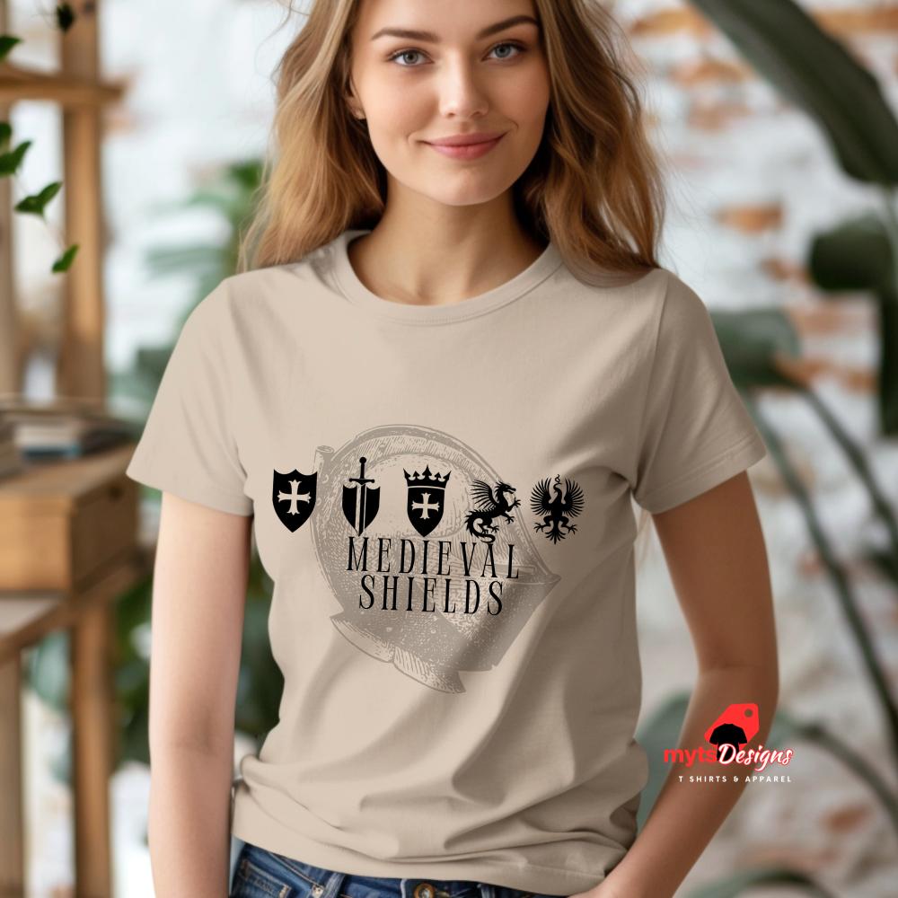 Woman wearing a neutral t-shirt with medieval shield emblems and knight’s helmet graphic, designed for history lovers and fantasy enthusiasts.