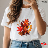 White t-shirt with autumn leaf design worn by a person, with 'Myts Designs' branding.