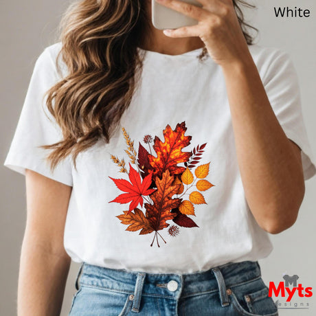 White t-shirt with autumn leaf design worn by a person, with 'Myts Designs' branding.