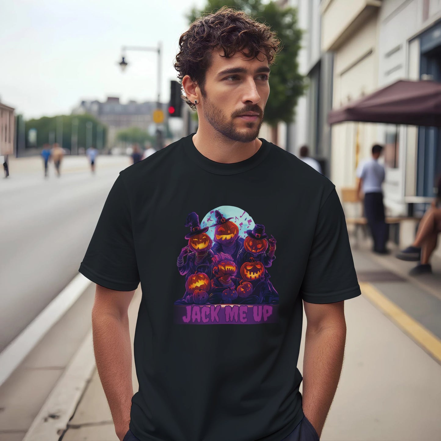 Man wearing a black t-shirt with Halloween-themed design on a city street.