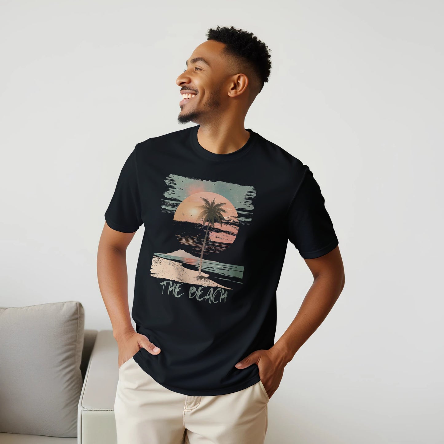 A male model wearing a black "The Beach" T-shirt