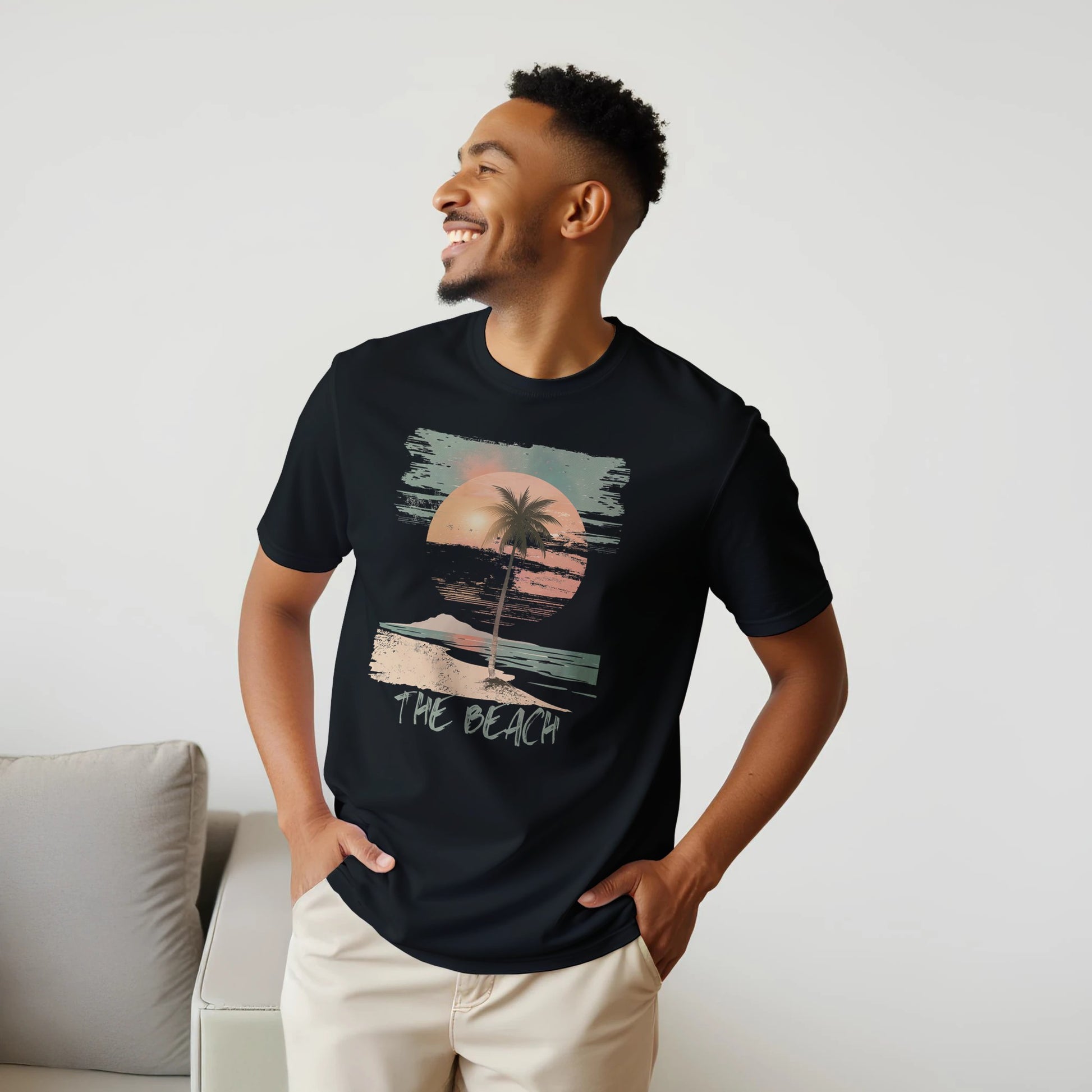 A male model wearing a black "The Beach" T-shirt
