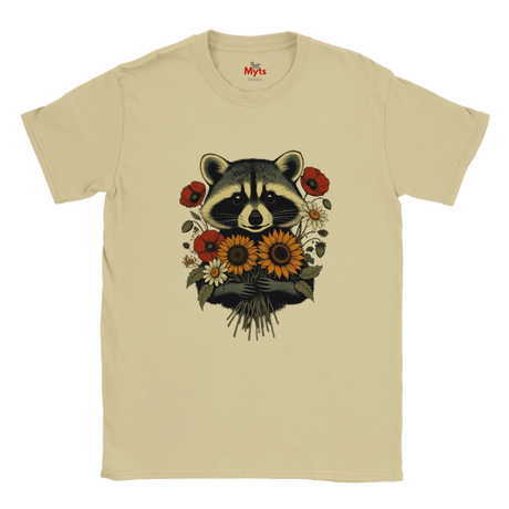 ASand crewneck t-shirt featuring a graphic print of a raccoon holding a bouquet of sunflowers and red poppies, displayed flat against a white background.