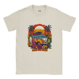 A white T-shirt with a vibrant graphic of a retro yellow Kombi van, surfboards, tropical flowers, palm trees, and a bold orange sunset.

