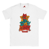 A flat lay white T-shirt featuring a vibrant graphic of cartoon puppies stacked in red, orange, blue, and yellow hues, with the playful text “WOOF!” below the design.