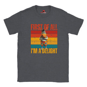 Casual dark heather tee displaying a retro-style donkey illustration with bold “First of All, I’m a Delight” vintage text, on a white background