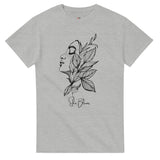 Gray t-shirt with a black and white illustration of a face and leaves on a white background