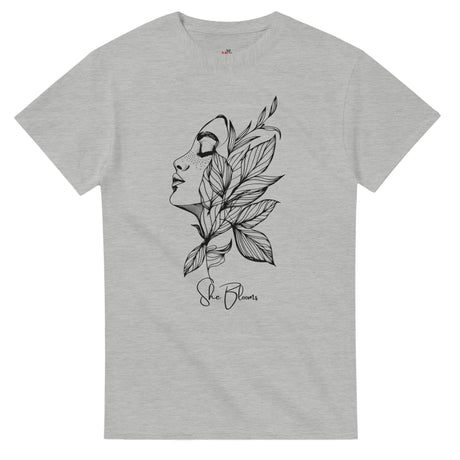 Gray t-shirt with a black and white illustration of a face and leaves on a white background