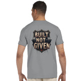 Man wearing a gray t-shirt with 'Built Not Given' design on the back