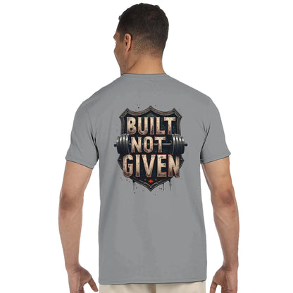 Man wearing a gray t-shirt with 'Built Not Given' design on the back