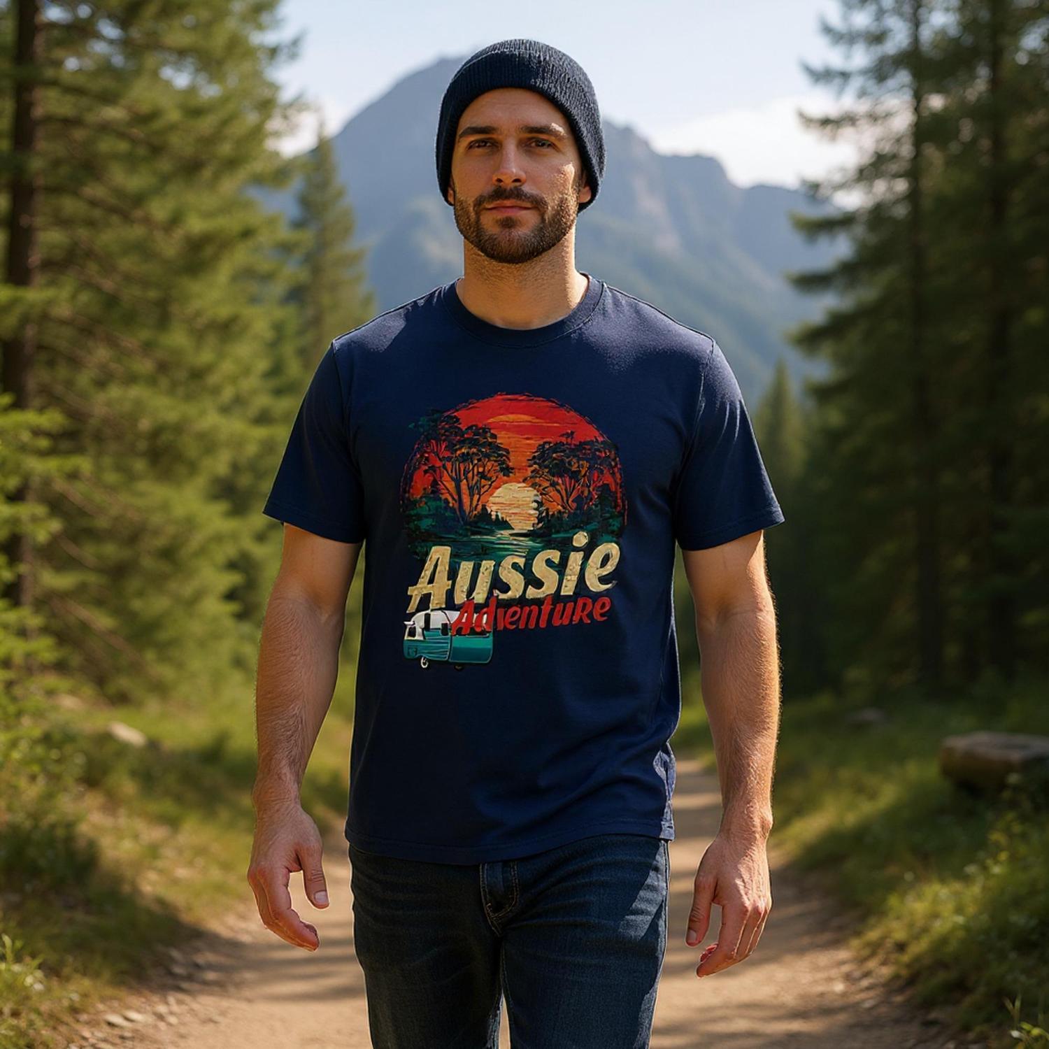 Man wearing a navy t-shirt with 'Aussie Adventure' design in a forest setting