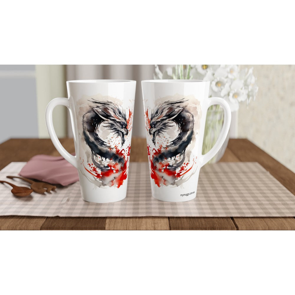 Two white ceramic mugs with a large black and red dragon illustration, displayed side-by-side on a checkered placemat on a wooden table.