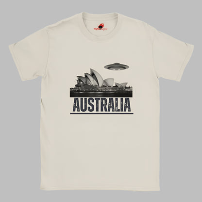 Front view of a soft casual tee showing the Sydney Opera House sails with a sleek spaceship graphic orbiting overhead, printed on ultra-soft Gildan 64000 cotton.