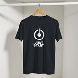 Black t-shirt with a white power symbol and 'JUST START' text on a hanger against a neutral background