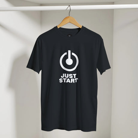 Black t-shirt with a white power symbol and 'JUST START' text on a hanger against a neutral background