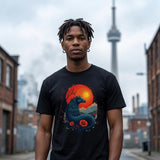 Person wearing a black t-shirt with a dragon design in an urban setting