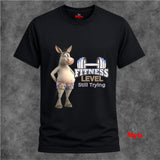 Black funny gym T-shirt with cartoon donkey in floral shorts, dumbbell graphic and Fitness Level Still Trying slogan.