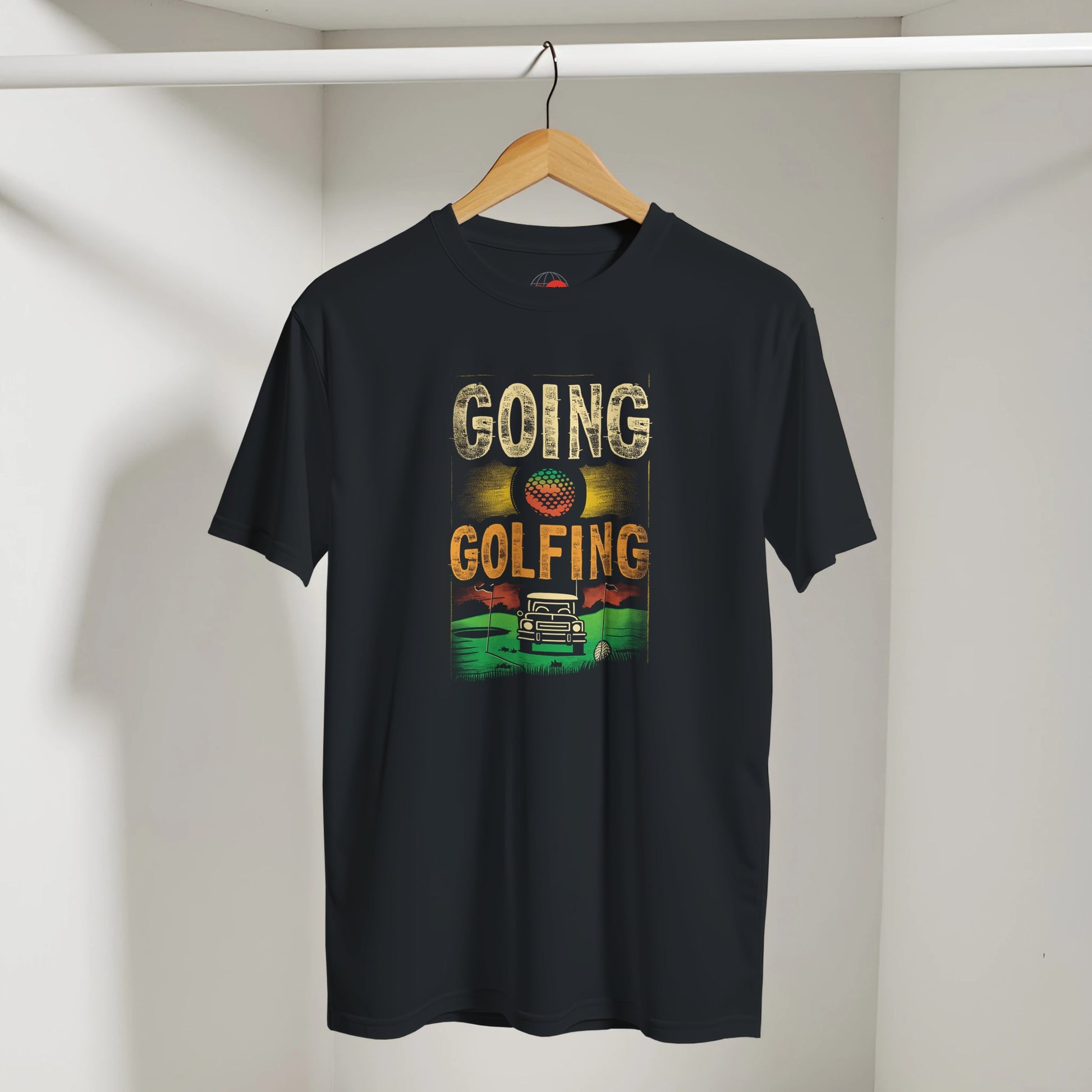 Black t-shirt with 'Going Golfing' graphic on a hanger against a white wall