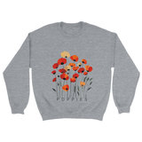 A Grey sweatshirt featuring a minimalist poppy flower design. The graphic displays red, orange, and muted gold poppies with slender stems and leaves, and the word “POPPiES” printed beneath. The cozy, casual outfit has a soft, modern aesthetic ideal for floral and nature-inspired fashion.