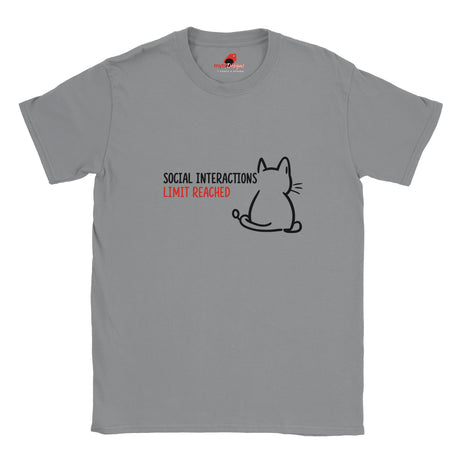 “White T-shirt laid flat with a minimal line art cat and text reading ‘Social Interactions Limit Reached’ in bold black and red font, humorous introvert design from MytsDesigns.com”

