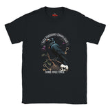 Black t-shirt with a crow and text design on a white background
