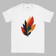 A white cotton T-shirt with a modern abstract autumn leaf design in layered shades of orange, red, yellow, and dark teal, styled on a wooden surface with a straw hat and denim jeans. The shirt features the MytsDesigns logo.
