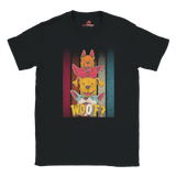 A flat lay black T-shirt featuring a playful graphic of four stacked colorful dogs in yellow, red, and blue tones with the word “Woof?” in bold, cartoonish text below.

