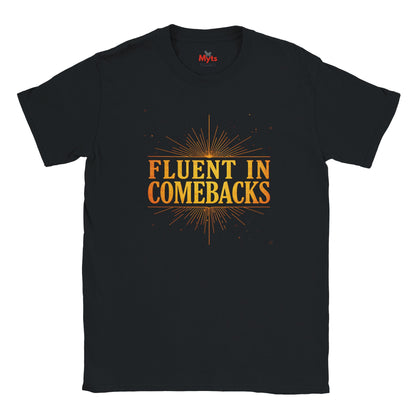 Fluent in Comebacks graphic T-shirt with gold typography statement design on a black casual unisex tee