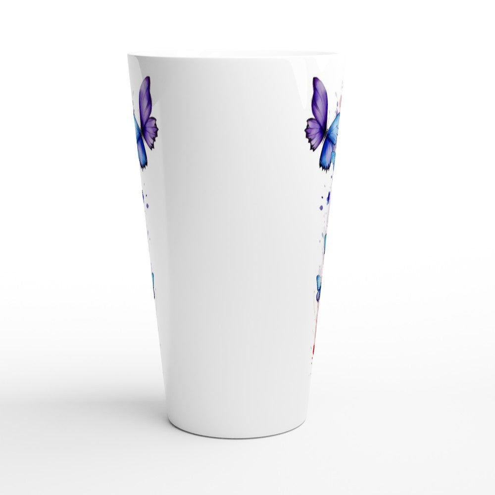 A white tapered drinking glass featuring a decorative print of purple and blue butterflies with paint splatter details, shown on a clean white background.