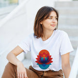 Woman wearing a white t-shirt with a colorful lotus flower design, sitting outdoors.