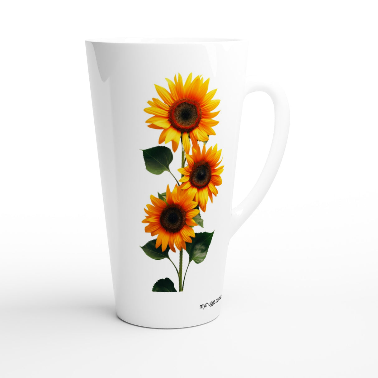 A tall white ceramic latte mug featuring a graphic print of three yellow and orange sunflowers with green leaves, shown on a clean white background.