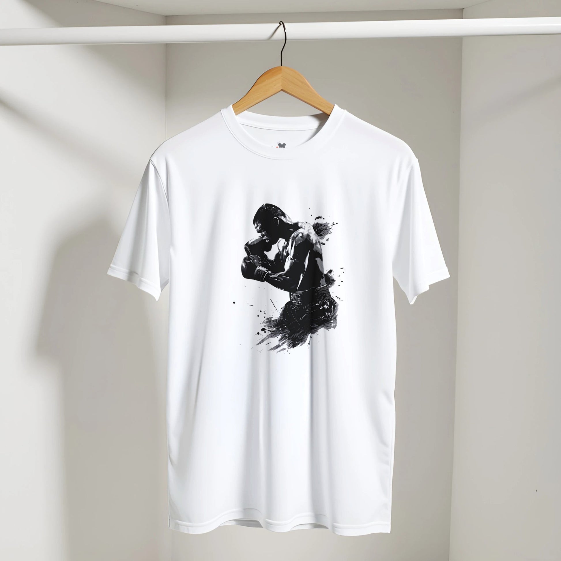 White t-shirt with black graphic design on a hanger against a white wall