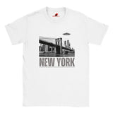White soft casual tee showing the New York City skyline with a stylized spaceship graphic soaring above, printed on ultra-soft Gildan 64000 cotton.